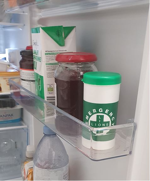 message in a bottle product in a fridge door
